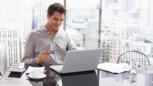 Businessman shopping online with credit card