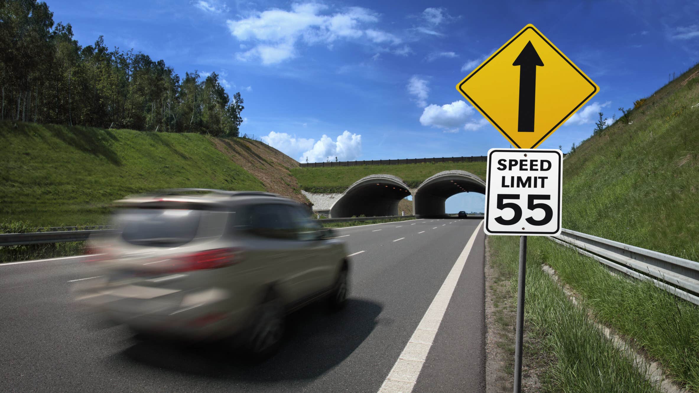 car driving over the 55 mph speed limit