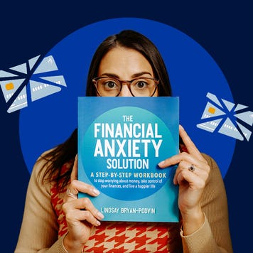 Author Lindsay Bryan-Podvin stands holding a copy of her financial book