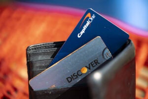 Capital One and Discover cards in a wallet.