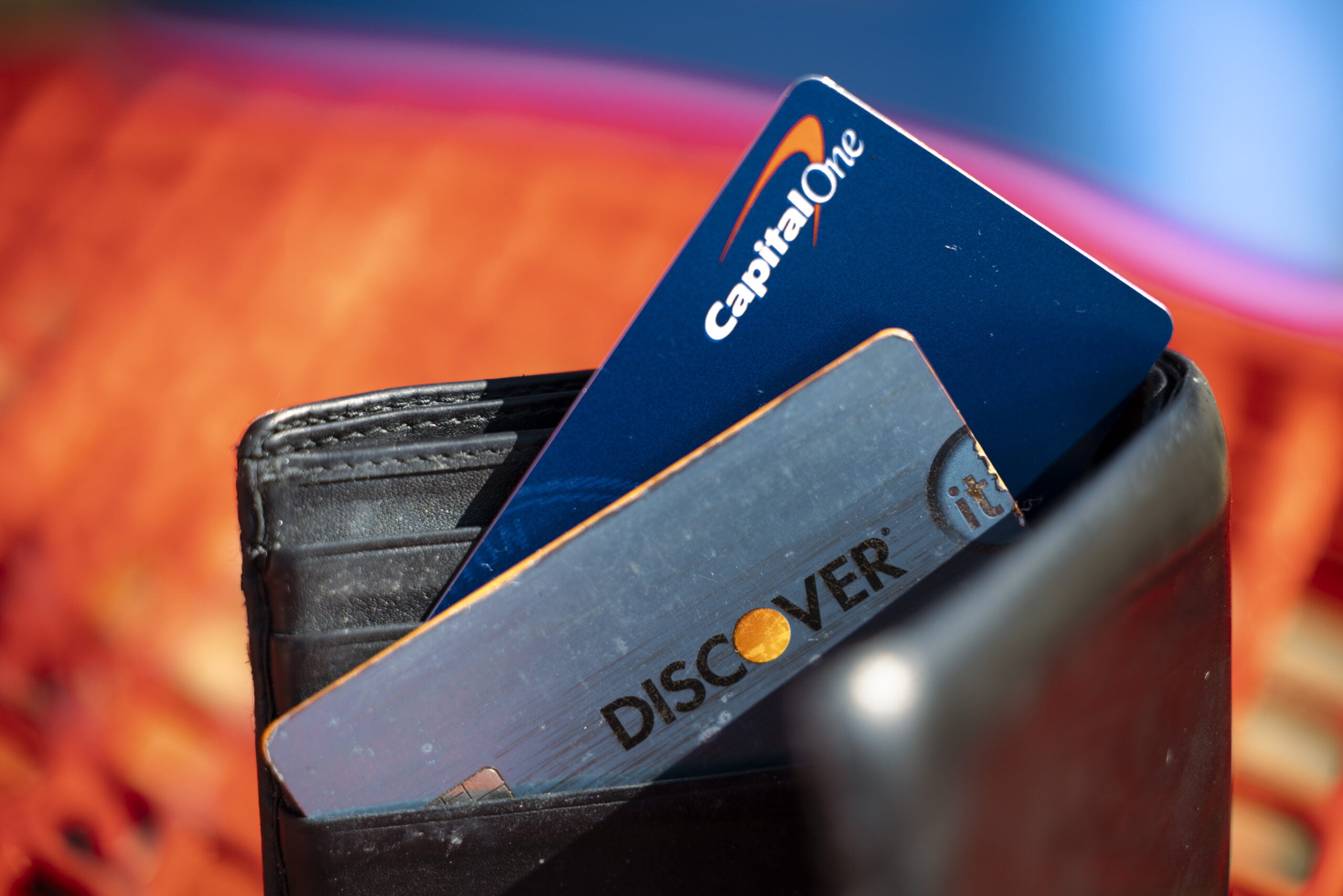 Capital One and Discover cards in a wallet.