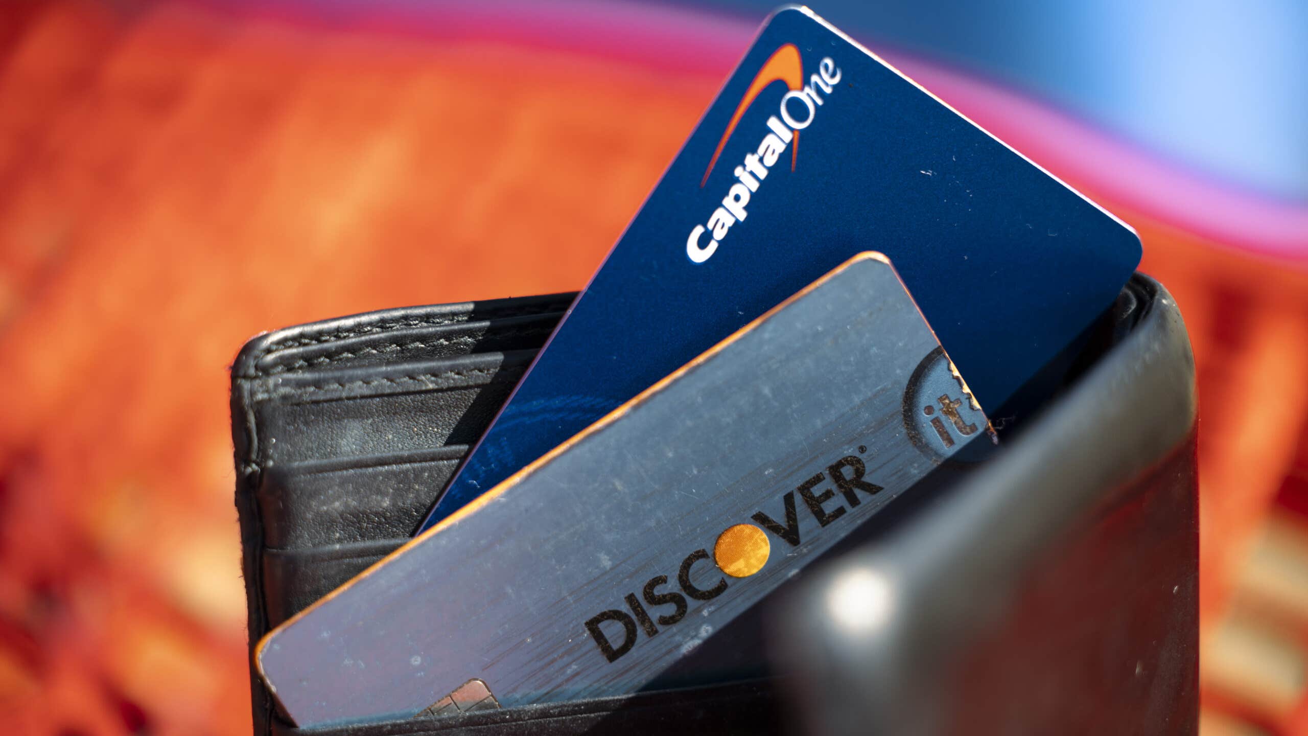 Capital One and Discover cards in a wallet.