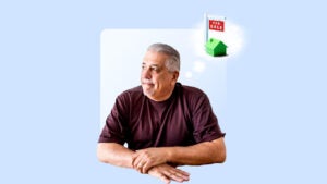 A gray-haired man thinks about buying a house