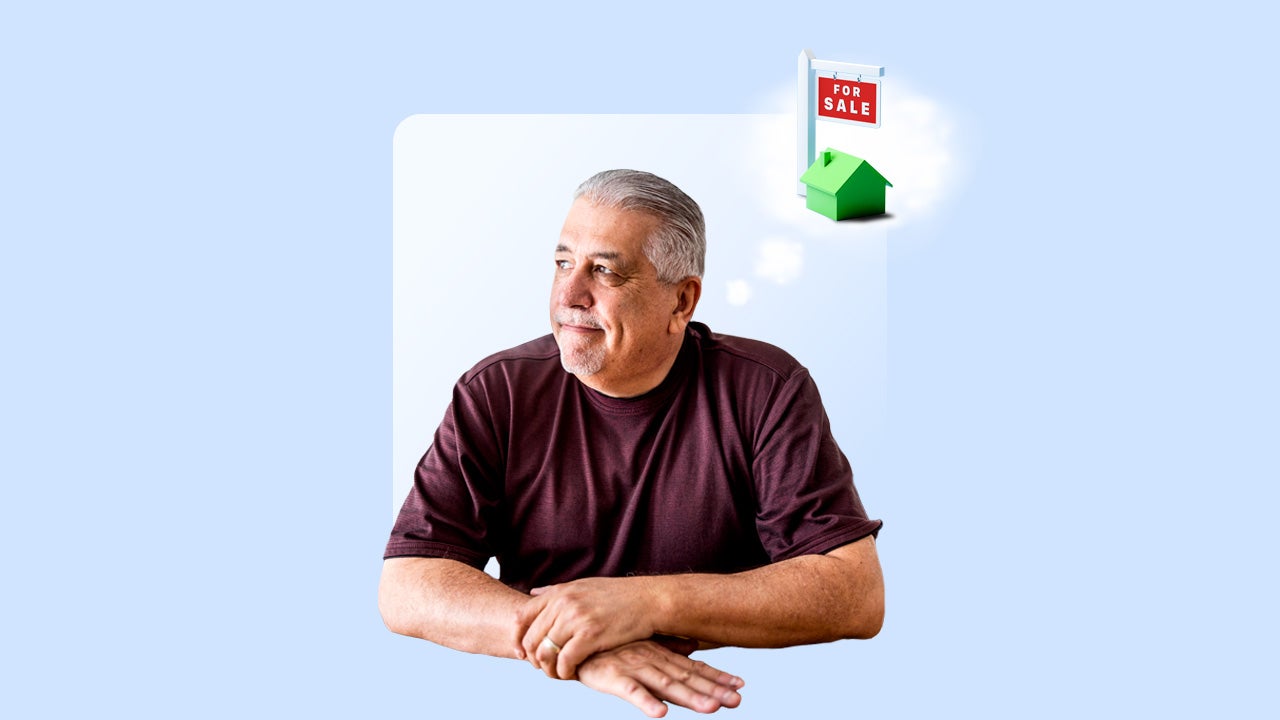 A gray-haired man thinks about buying a house