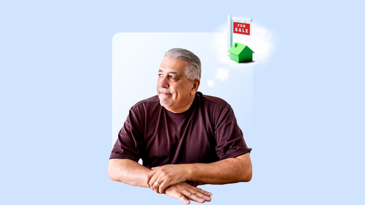 A gray-haired man thinks about buying a house