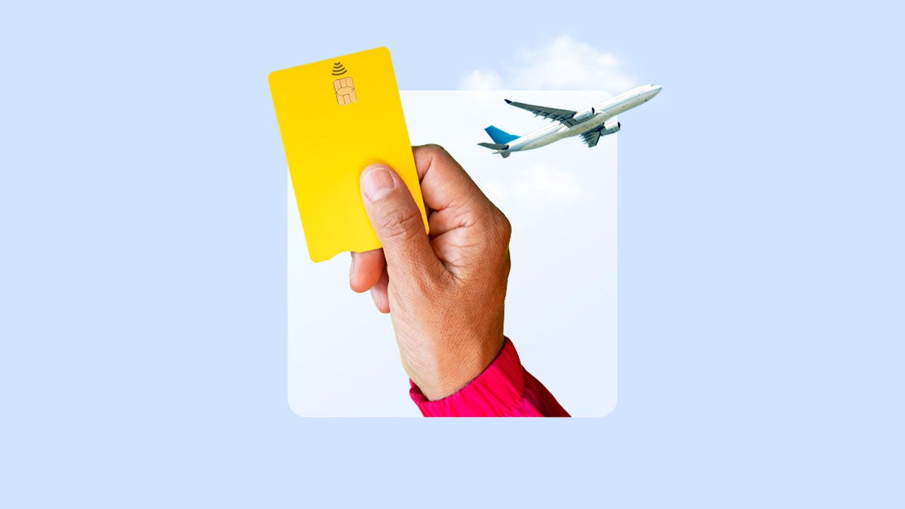 An illustration of a hand holding a credit card and a plane
