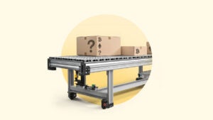 Boxes rolling off a conveyor belt.