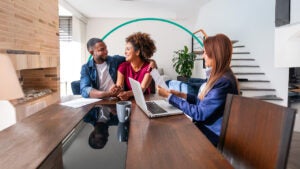 Couple closing on a home purchase