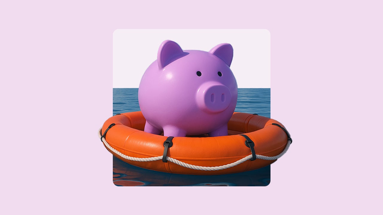 Image of a round pink piggybank in a life raft floating on water.