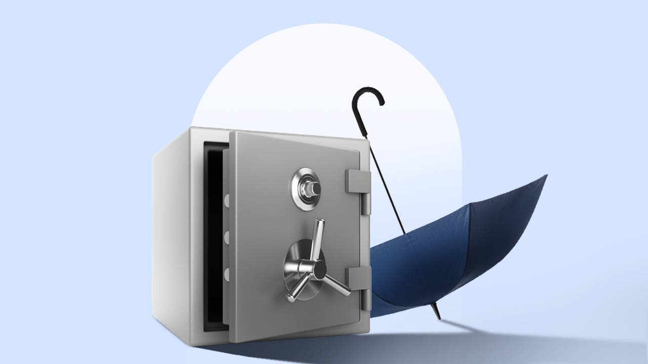 An open umbrella sits upside down next to an open safe on a blue background.