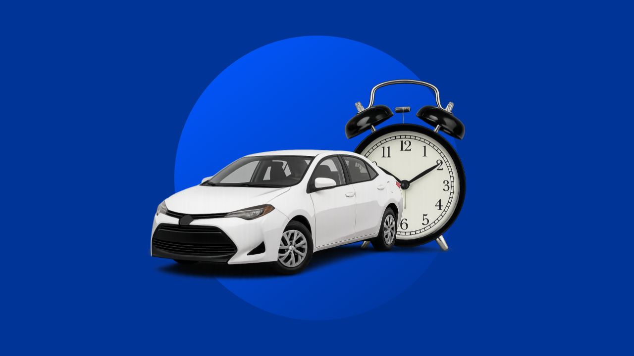 A sedan and an alarm clock are seen against a solid blue background