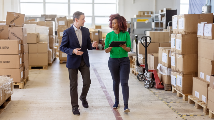 A business owner discusses strategy with an advisor.