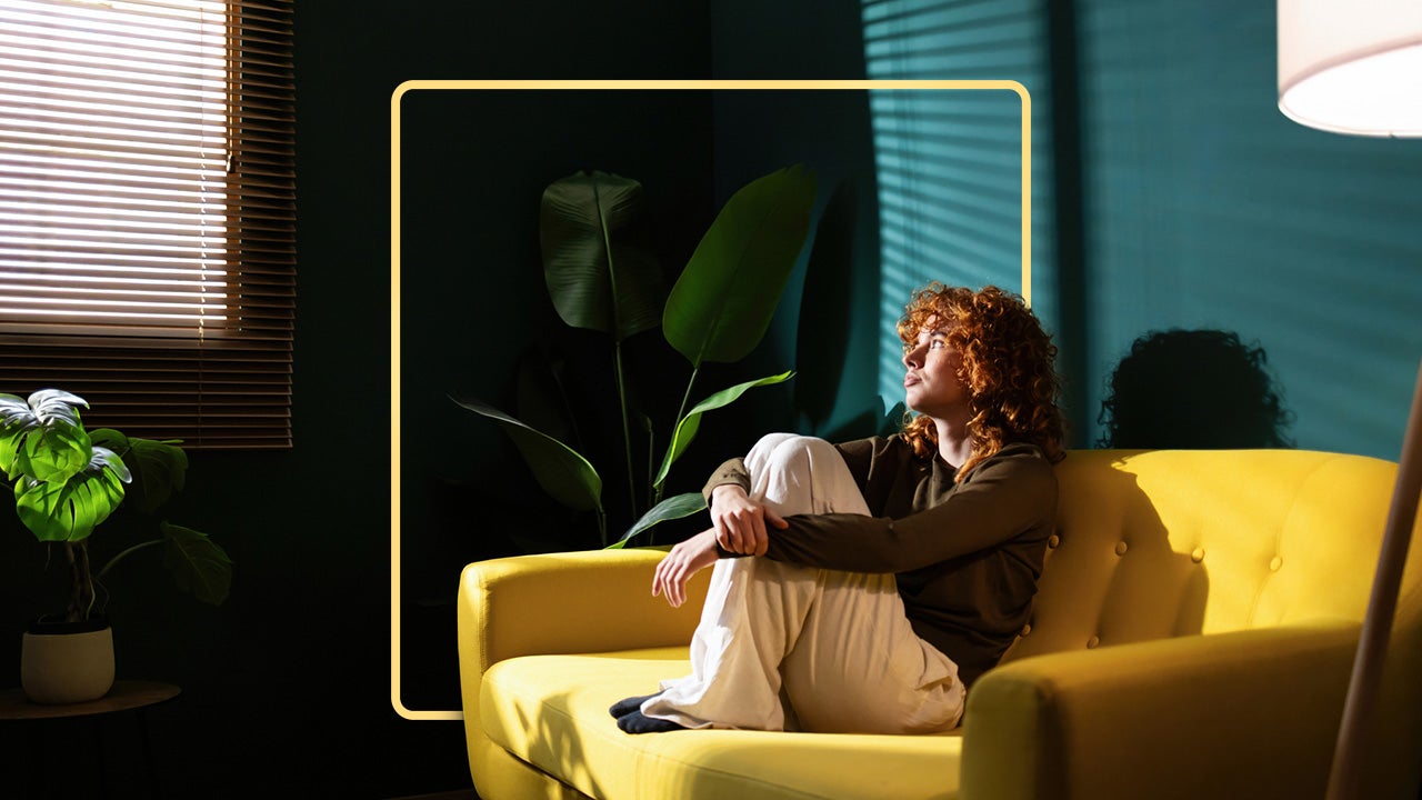 Person sitting in chair looking into a room.