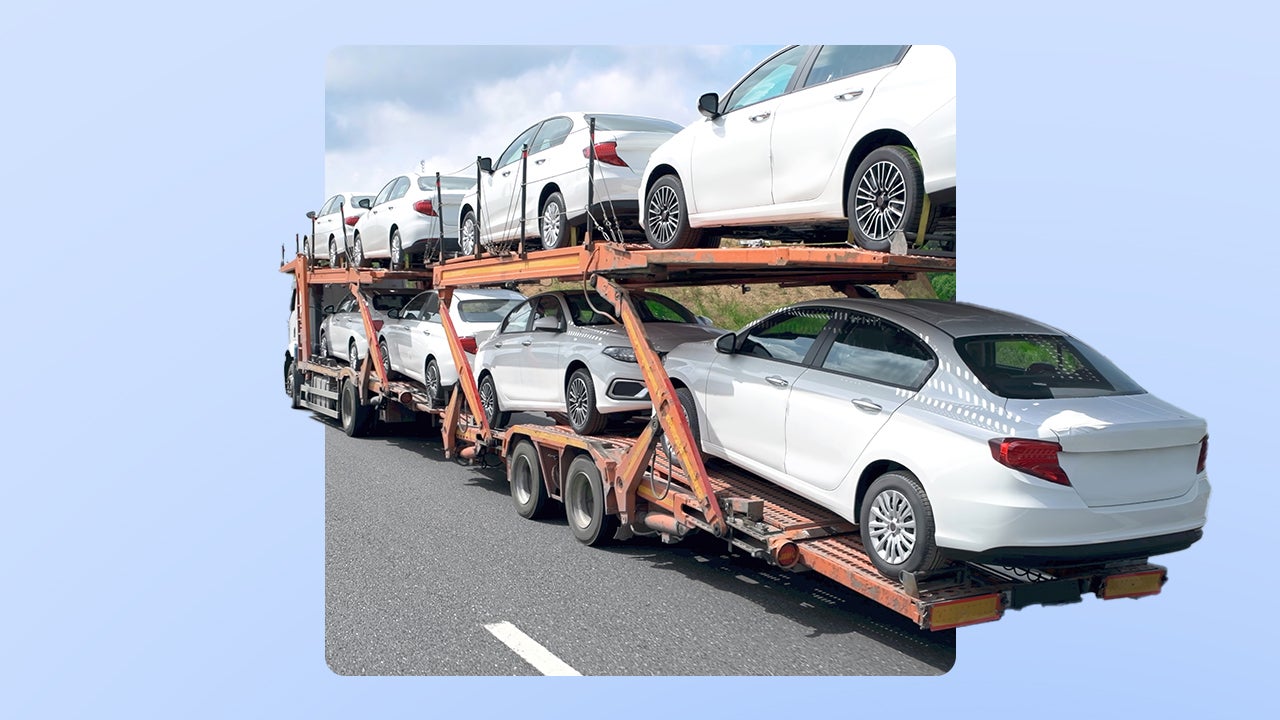 A truck hauling a number of white passenger vehicles in two stacks. The image is imposed over an illustrated blue background.