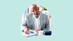 A financial planner references a graph.