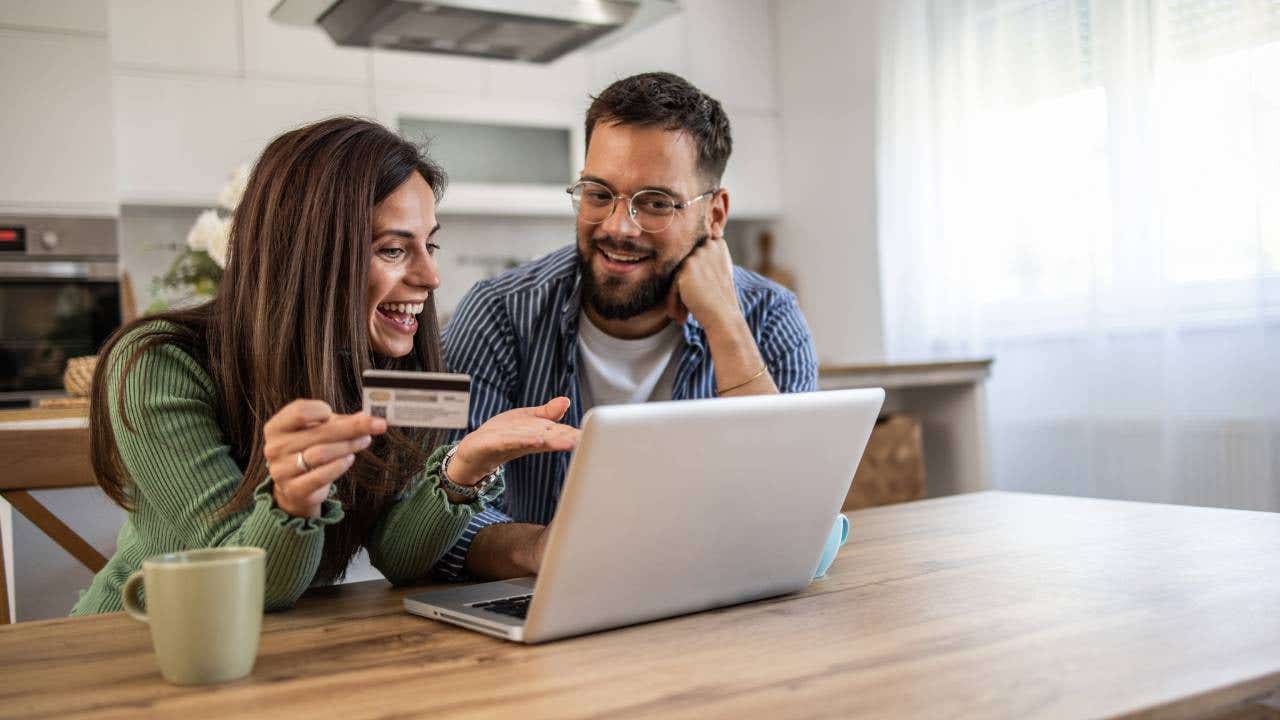 Man and woman shopping from the comfort of their home
