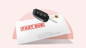 Car key floating above a past due auto bill in an envelope against a pink background