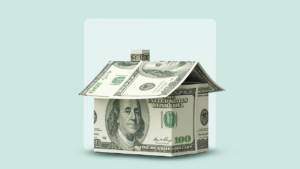 Home made of $100 bills against a green backdrop