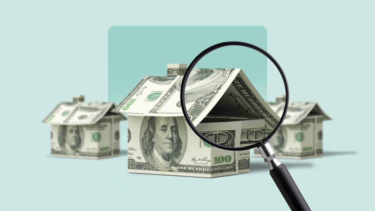 A house made of money, being looked at under a microscope.