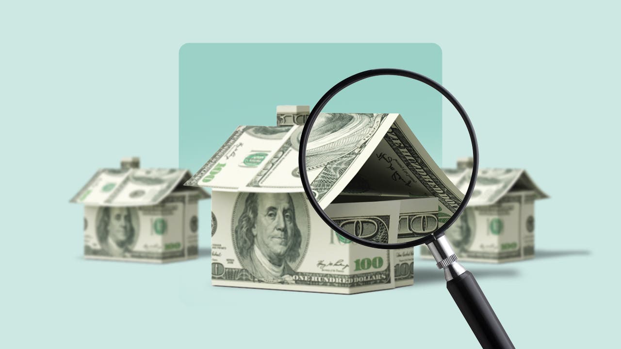 A house made of money, being looked at under a microscope.