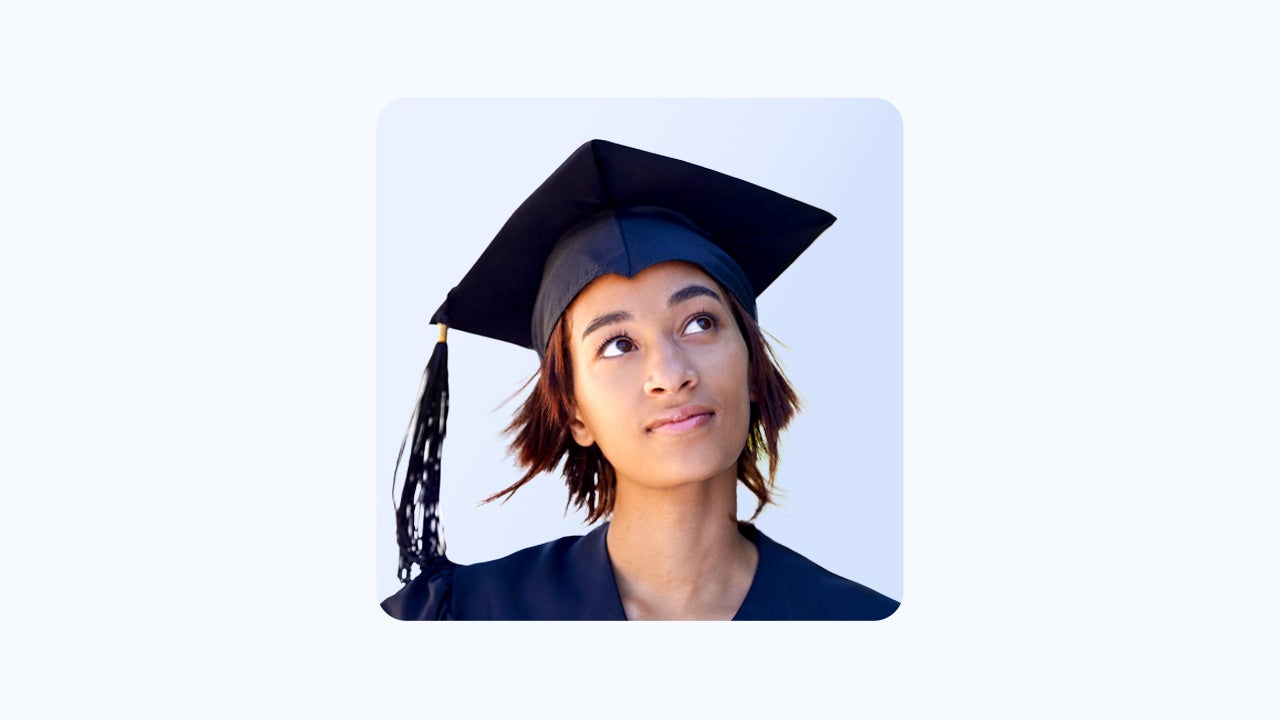 A headshot of a graduating student thinking about something