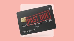 A credit card with a "past due" stamp on the front