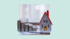 A house next to piles of coins.