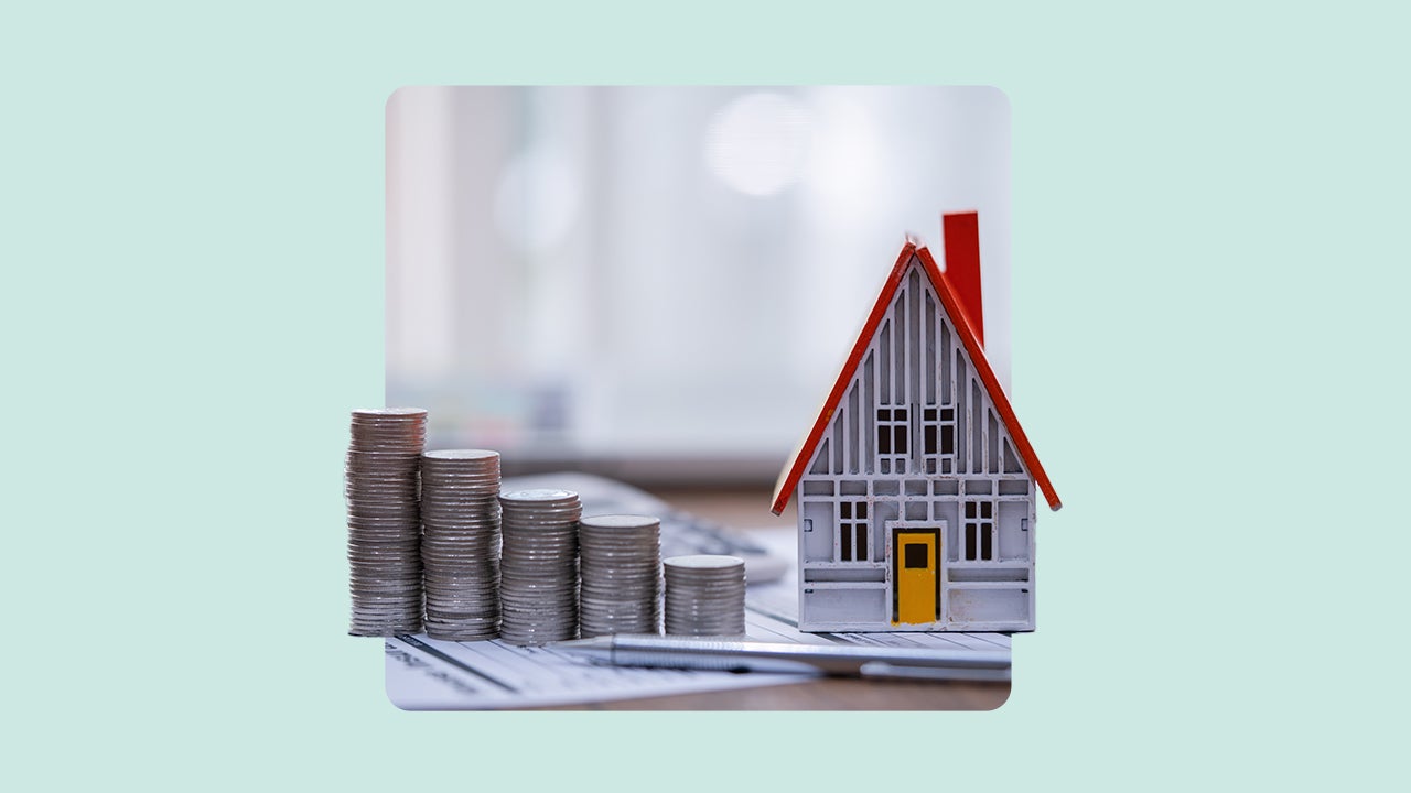 A house next to piles of coins.