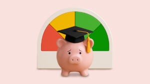 A piggy bank with sad eyes wearing a graduation cap and standing in front of a credit score meter.