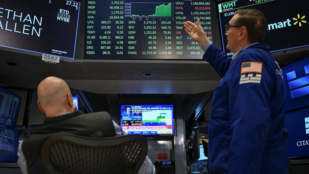 NYSE stock exchange traders looking at the list of index prices including the S&P 500