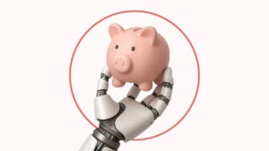 A pink piggy bank being held by a robotic/animatronic hand.