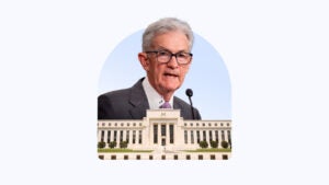 Image of Jerome Powell above the Federal Reserve Building.