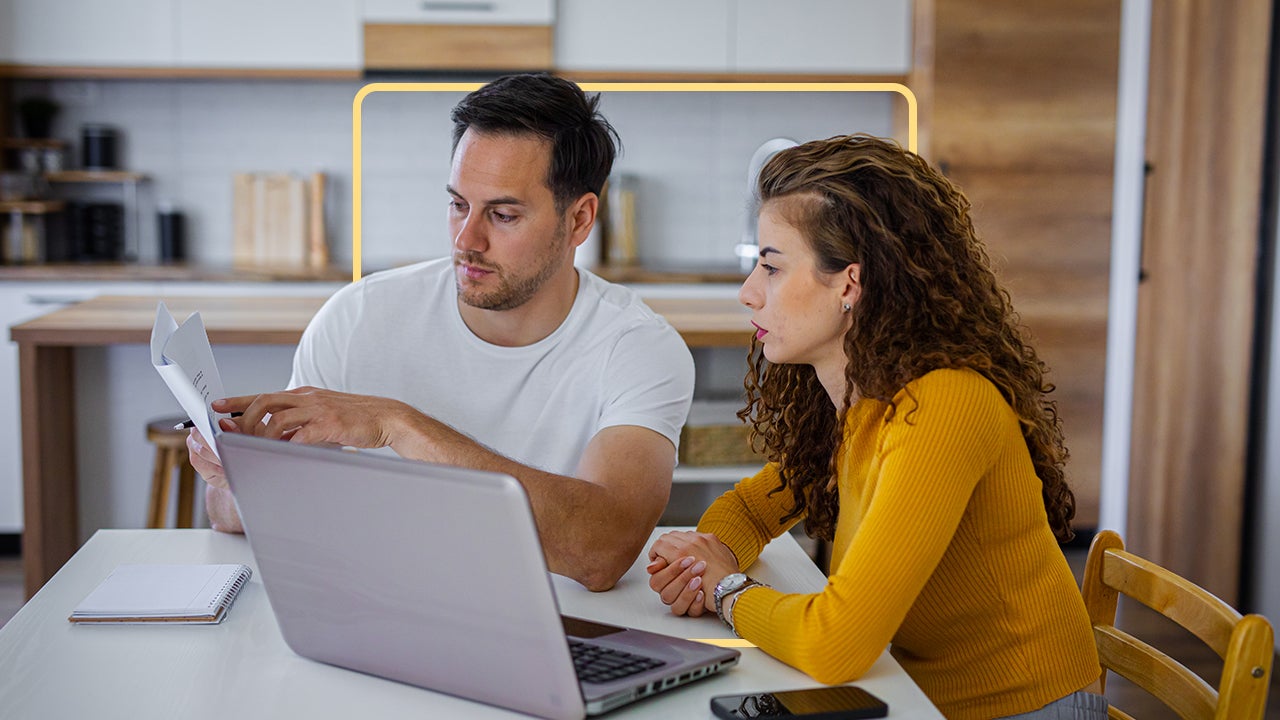 a couple looking at a documents