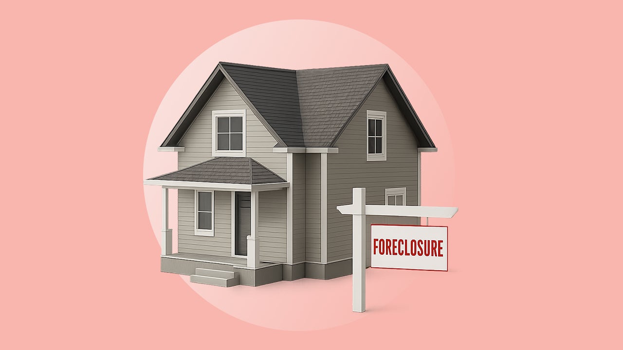 House with sign in the front.