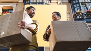 two men moving boxes