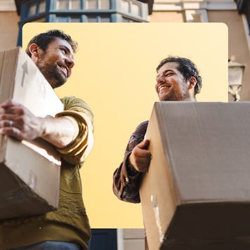 two men moving boxes