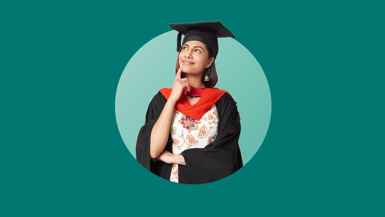 Female college graduate in cap and gown thinking about something