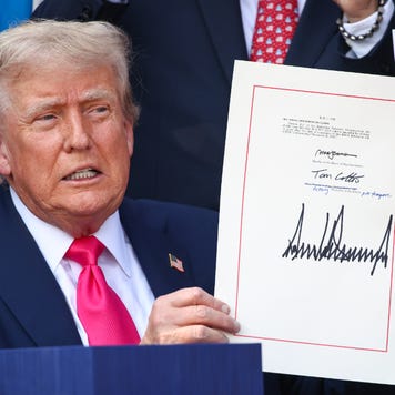 Donald Trump holds signed budget reconcilation bill