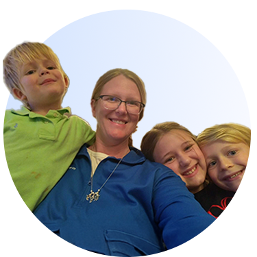 A selfie view of a mom with kids.