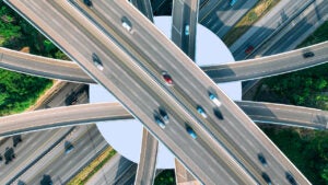 aerial view of vehicles traveling on crisscrossing highways