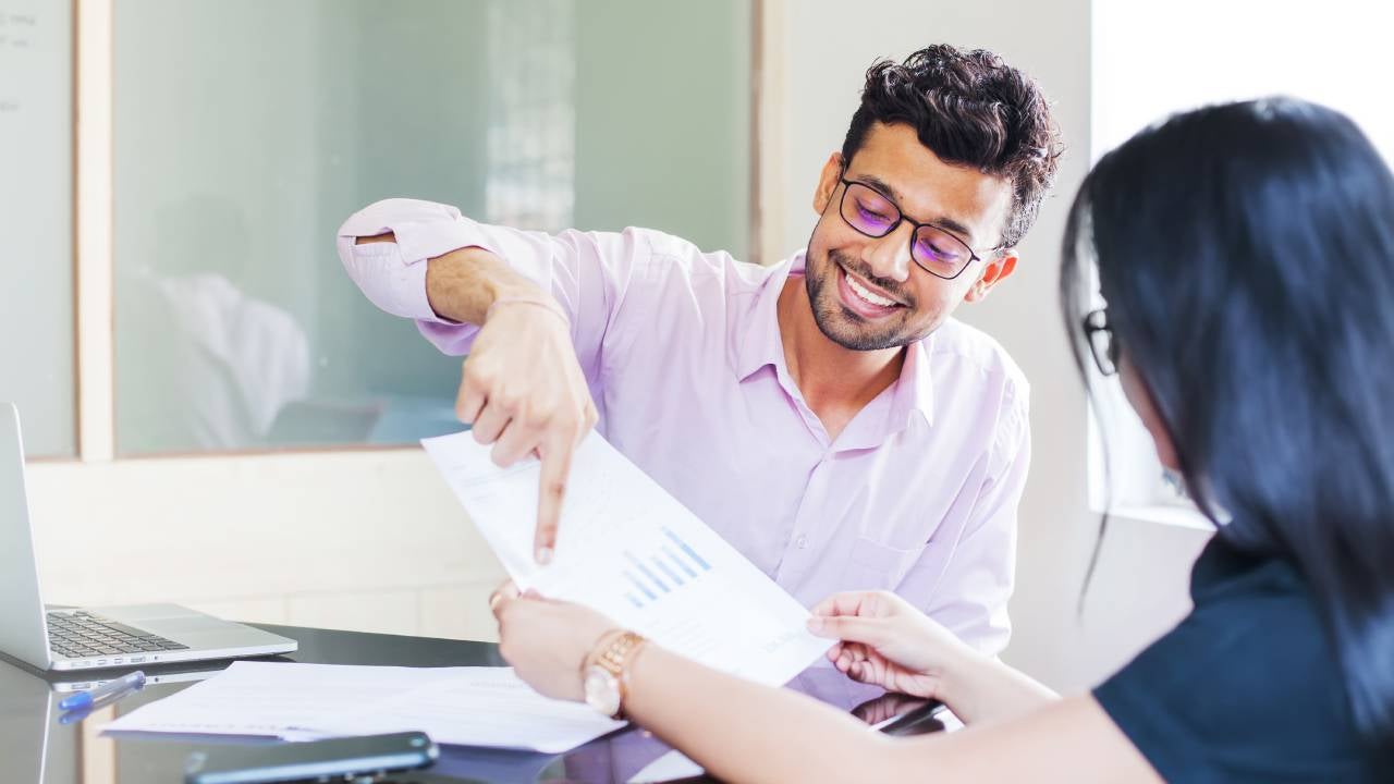 Advisor explaining charts to a client.