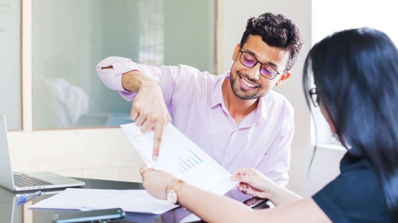 Advisor explaining charts to a client.