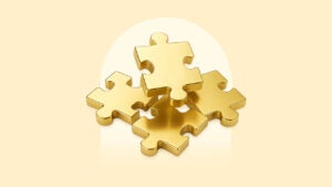 Gold puzzle pieces on a gold background