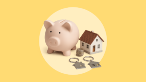 A piggy bank, a model of a house, a stack of coins and two keyrings.