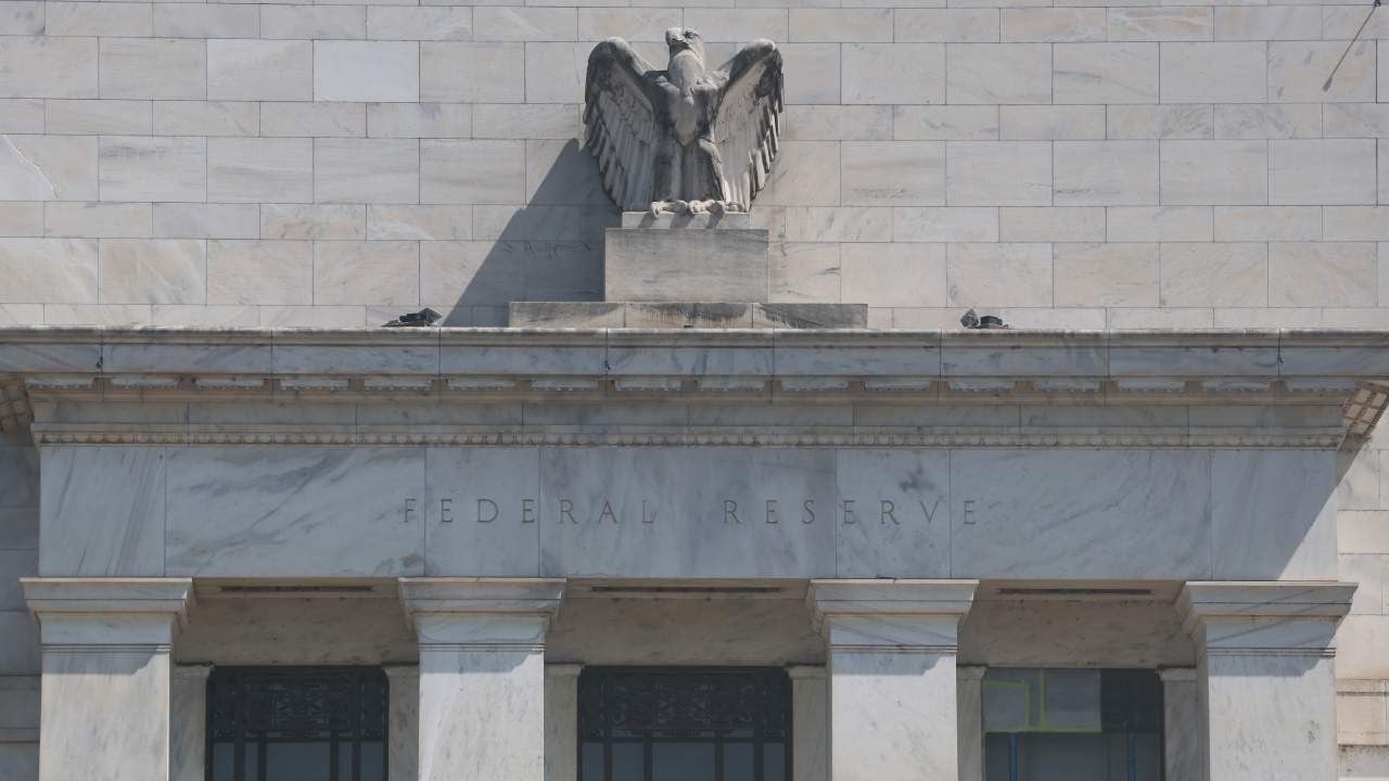 Close-up photo of the front of the Federal Reserve in Washington, DC, with the name "Federal Reserve" below the bust of the eagle.