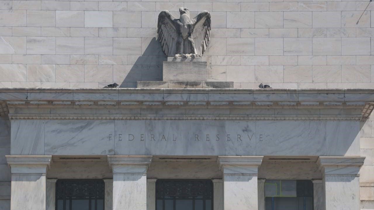 Close-up photo of the front of the Federal Reserve in Washington, DC, with the name "Federal Reserve" below the bust of the eagle.