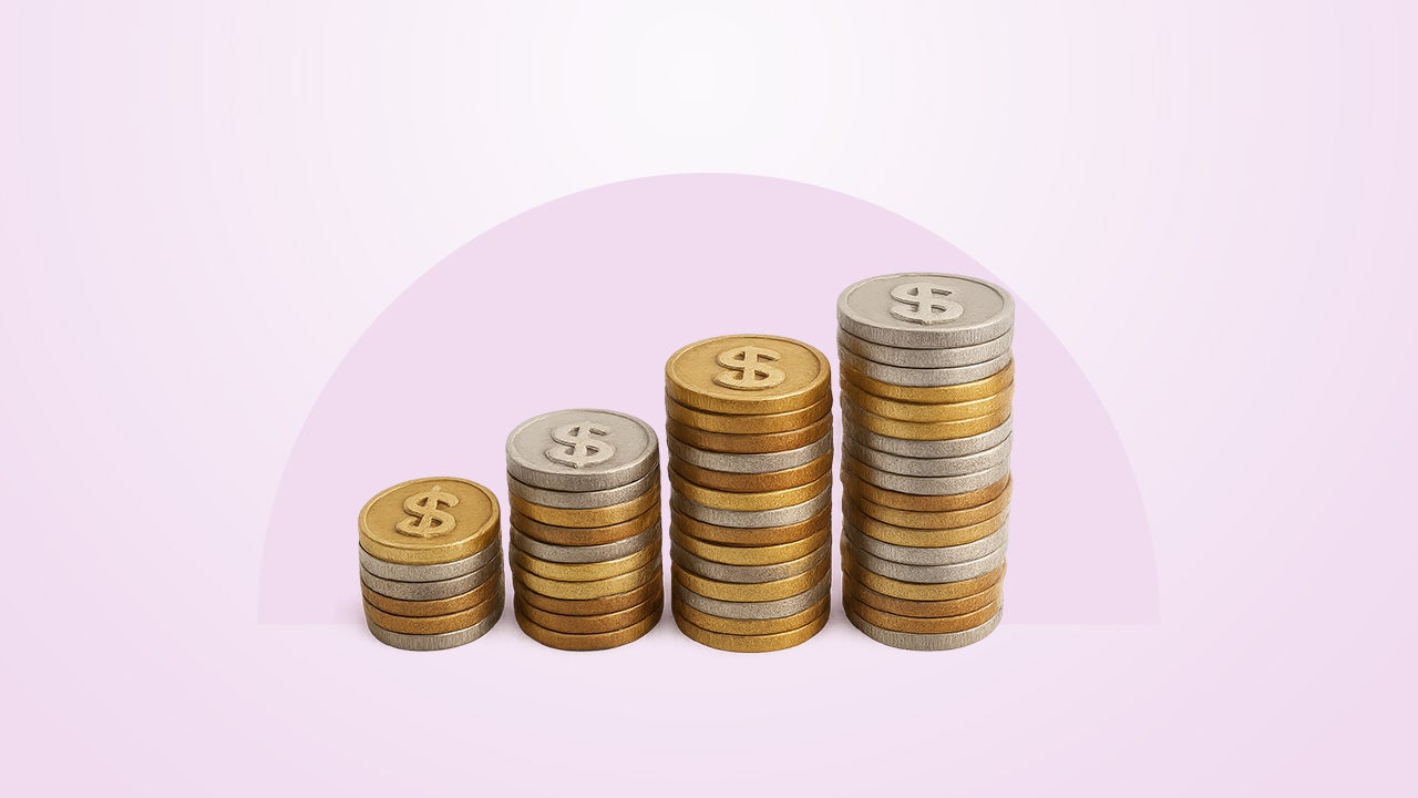 Four stacks of coins on a purple background.