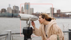Person looking through telescope