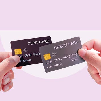 Design element of a pair of hands holding a debt card and the other holding a credit card