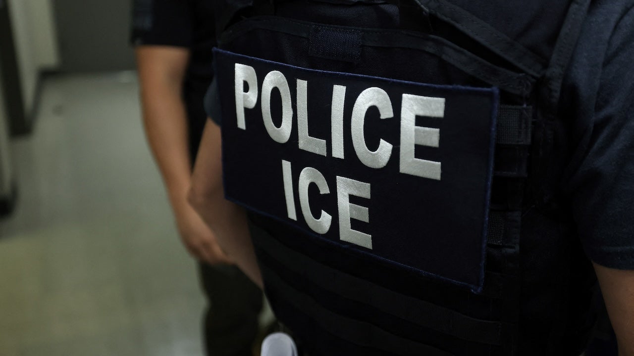An agent of Immigration and Customs Enforcement (ICE) waits in a hallway outside of a courtroom at New York Federal Plaza Immigration Court inside the Jacob K. Javitz Federal Building in New York on July 17, 2025.
